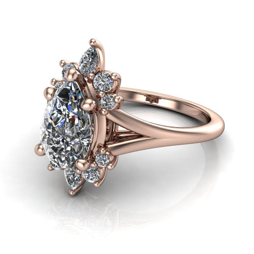 Sage pear halo engagement ring in 18K Rose Gold, three-quarter perspective showing the center framed by a vintage cluster halo of pear and round diamonds above a split shank