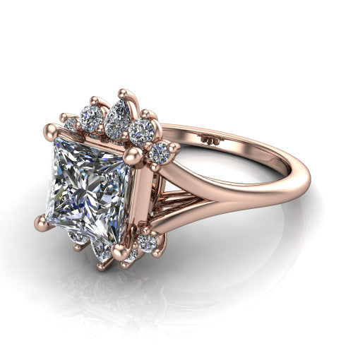 Sage princess halo engagement ring in 18K Rose Gold, three-quarter perspective showing the center framed by a vintage cluster halo of pear and round diamonds above a split shank