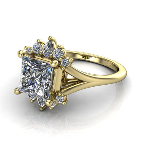 Sage princess halo engagement ring in 18K Yellow Gold, three-quarter perspective showing the center framed by a vintage cluster halo of pear and round diamonds above a split shank