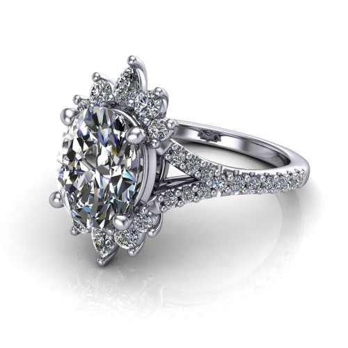 Sienna oval halo engagement ring in Platinum, three-quarter perspective showing the center framed by a vintage cluster halo of pear and round diamonds above a pav&eacute; split shank