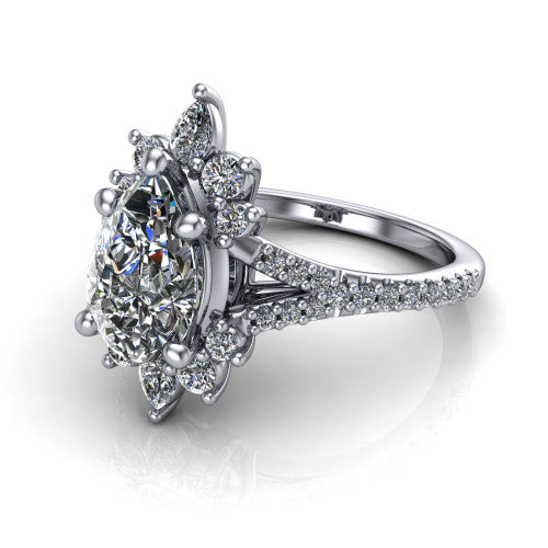 Sienna pear halo engagement ring in 18K White Gold, three-quarter perspective showing the center framed by a vintage cluster halo of pear and round diamonds above a pav&eacute; split shank