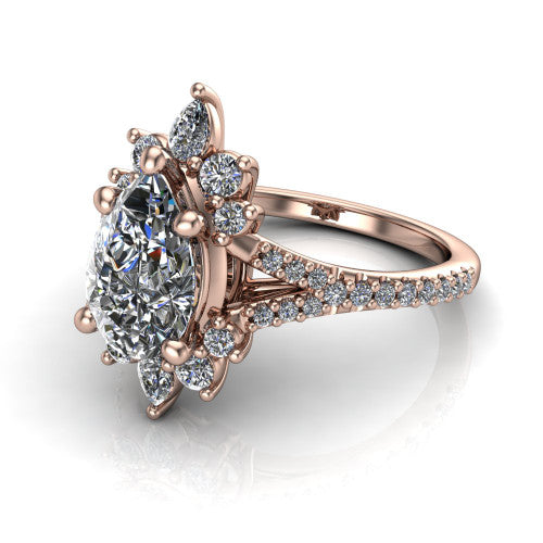 Sienna pear halo engagement ring in 14K Rose Gold, three-quarter perspective showing the center framed by a vintage cluster halo of pear and round diamonds above a pav&eacute; split shank