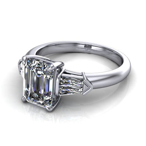 Gracie emerald three stone engagement ring in 14K White Gold, three-quarter perspective showing the emerald center diamond between tapered baguette side stones