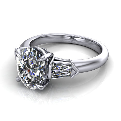 Gracie oval three stone engagement ring in 14K White Gold, three-quarter perspective showing the oval center diamond between tapered baguette side stones