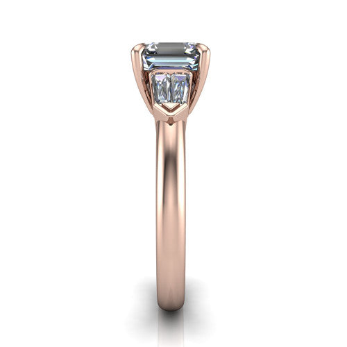 Gracie square emerald three stone engagement ring in 14K Rose Gold, side profile showing the baguette side stones and polished band
