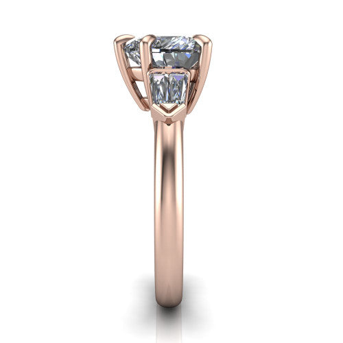 Gracie heart three stone engagement ring in 18K Rose Gold, side profile showing the baguette side stones and polished band