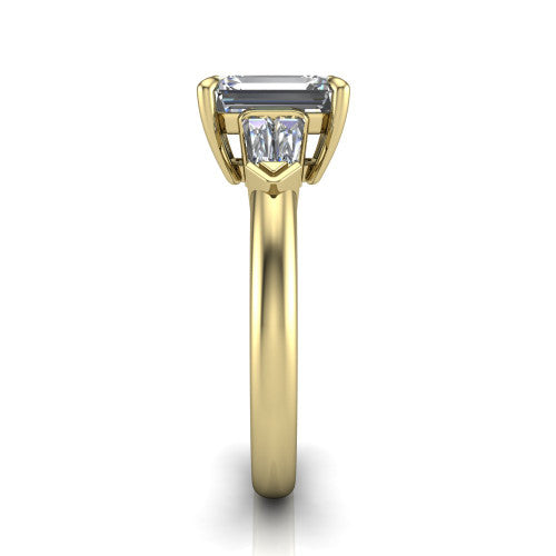 Gracie emerald three stone engagement ring in 14K Yellow Gold, side profile showing the baguette side stones and polished band