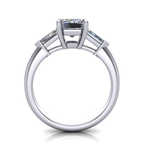 Gracie emerald three stone engagement ring in Platinum, through-finger front profile showing the open basket and polished band