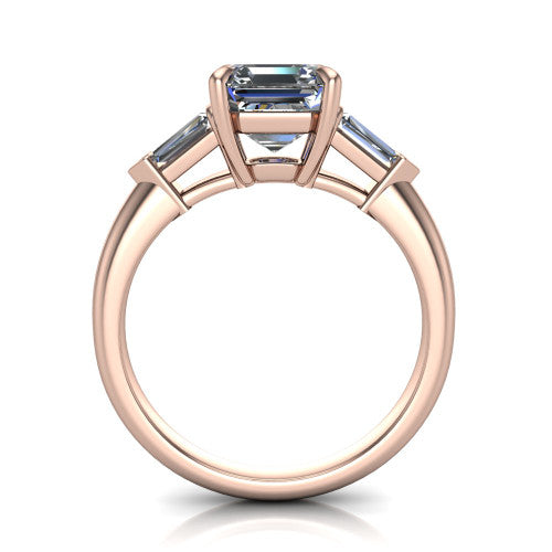 Gracie square emerald three stone engagement ring in 18K Rose Gold, through-finger front profile showing the open basket and polished band