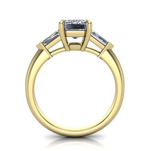 Gracie emerald three stone engagement ring in 18K Yellow Gold, through-finger front profile showing the open basket and polished band