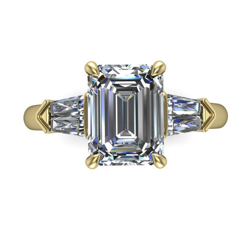 Gracie emerald three stone engagement ring in 18K Yellow Gold, top-down view showing the emerald center diamond and baguette accents