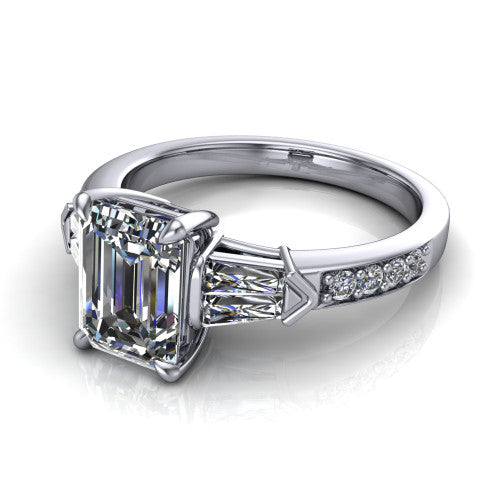 Audrey emerald three stone engagement ring in 14K White Gold, three-quarter perspective showing the center diamond between two tapered baguette side stones above a pav&eacute; band