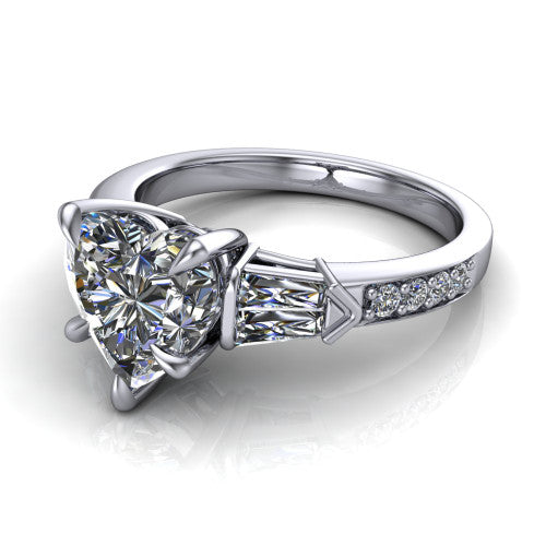 Audrey heart three stone engagement ring in Platinum, three-quarter perspective showing the center diamond between two tapered baguette side stones above a pav&eacute; band