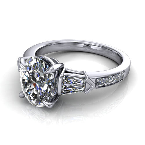 Audrey oval three stone engagement ring in 14K White Gold, three-quarter perspective showing the center diamond between two tapered baguette side stones above a pav&eacute; band