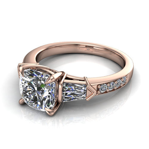 Audrey cushion three stone engagement ring in 18K Rose Gold, three-quarter perspective showing the center diamond between two tapered baguette side stones above a pav&eacute; band