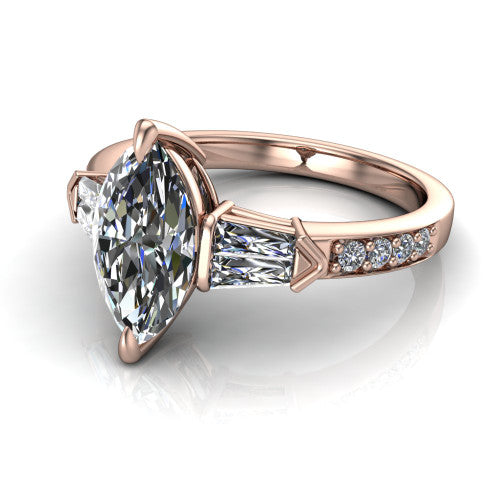 Audrey marquise three stone engagement ring in 14K Rose Gold, three-quarter perspective showing the center diamond between two tapered baguette side stones above a pav&eacute; band