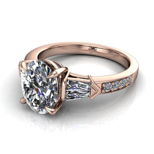 Audrey oval three stone engagement ring in 18K Rose Gold, three-quarter perspective showing the center diamond between two tapered baguette side stones above a pav&eacute; band