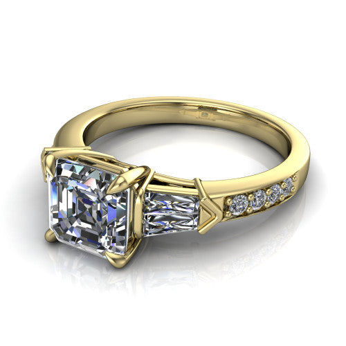 Audrey asscher three stone engagement ring in 14K Yellow Gold, three-quarter perspective showing the center diamond between two tapered baguette side stones above a pav&eacute; band