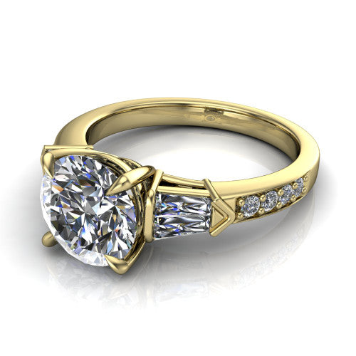 Audrey round three stone engagement ring in 14K Yellow Gold, three-quarter perspective showing the center diamond between two tapered baguette side stones above a pav&eacute; band