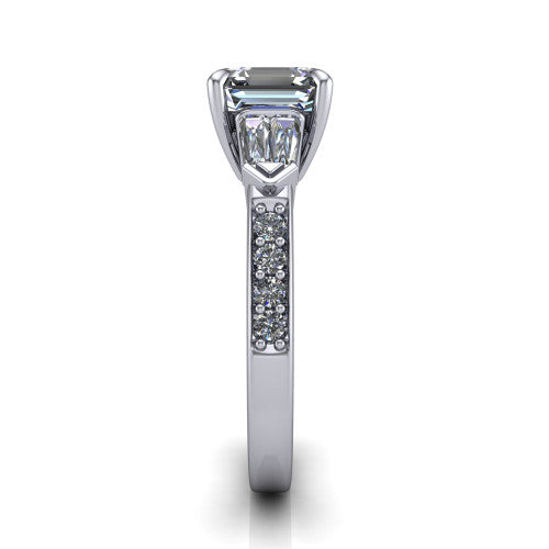 Audrey asscher three stone engagement ring in Platinum, side profile showing the tapered baguette side stone and the round diamonds running down the shank
