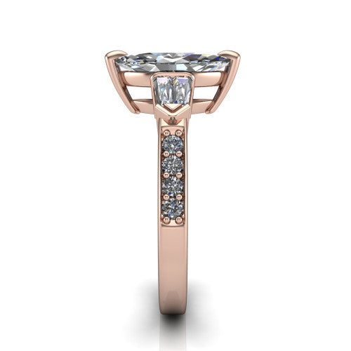 Audrey marquise three stone engagement ring in 14K Rose Gold, side profile showing the tapered baguette side stone and the round diamonds running down the shank