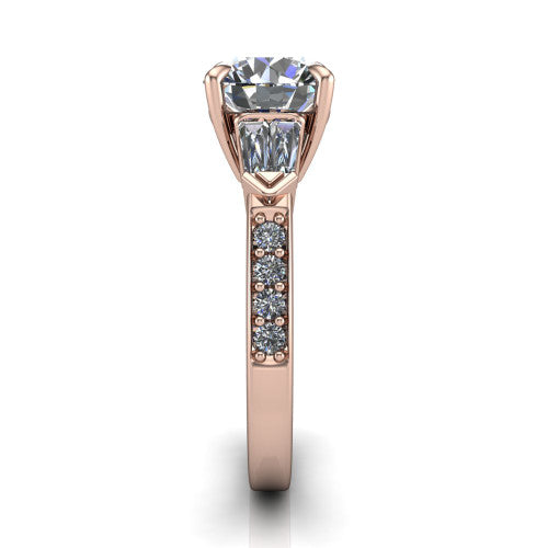 Audrey round three stone engagement ring in 18K Rose Gold, side profile showing the tapered baguette side stone and the round diamonds running down the shank