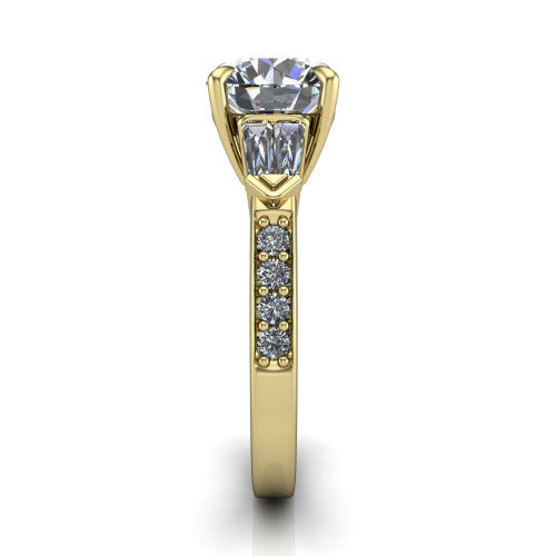 Audrey round three stone engagement ring in 18K Yellow Gold, side profile showing the tapered baguette side stone and the round diamonds running down the shank