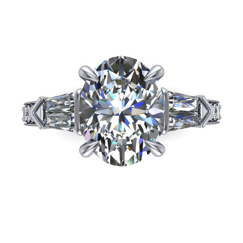 Audrey oval three stone engagement ring in Platinum, top-down view showing the center diamond flanked by two tapered baguette side stones over a diamond-set shank