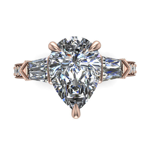 Audrey pear three stone engagement ring in 18K Rose Gold, top-down view showing the center diamond flanked by two tapered baguette side stones over a diamond-set shank
