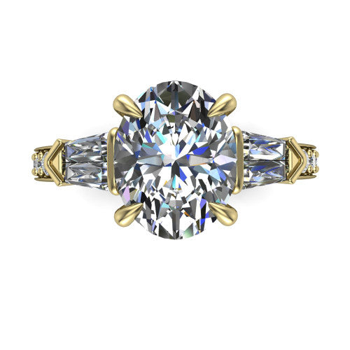 Audrey oval three stone engagement ring in 14K Yellow Gold, top-down view showing the center diamond flanked by two tapered baguette side stones over a diamond-set shank