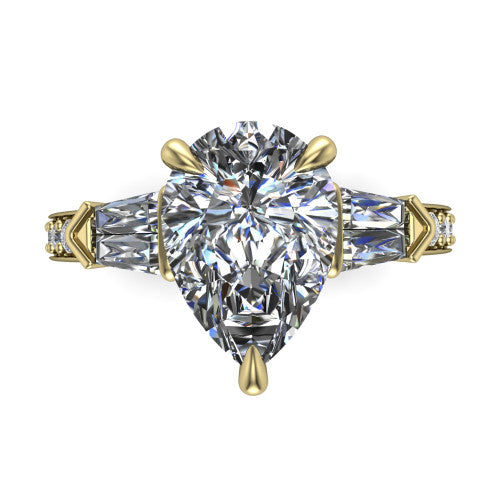 Audrey pear three stone engagement ring in 14K Yellow Gold, top-down view showing the center diamond flanked by two tapered baguette side stones over a diamond-set shank