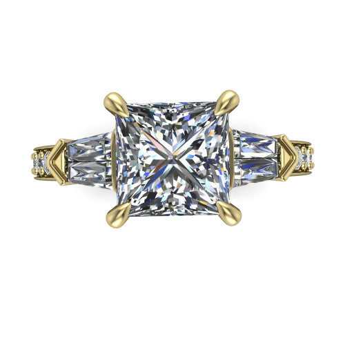 Audrey princess three stone engagement ring in 18K Yellow Gold, top-down view showing the center diamond flanked by two tapered baguette side stones over a diamond-set shank