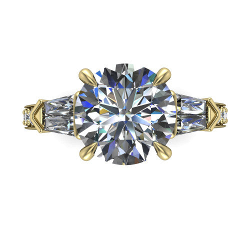 Audrey round three stone engagement ring in 14K Yellow Gold, top-down view showing the center diamond flanked by two tapered baguette side stones over a diamond-set shank
