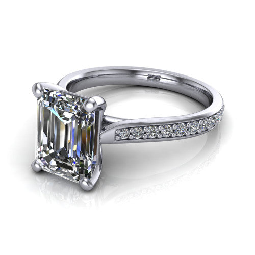 Ruby emerald classic engagement ring in Platinum, three-quarter perspective showing the solitaire center diamond raised above a pav&eacute; shank