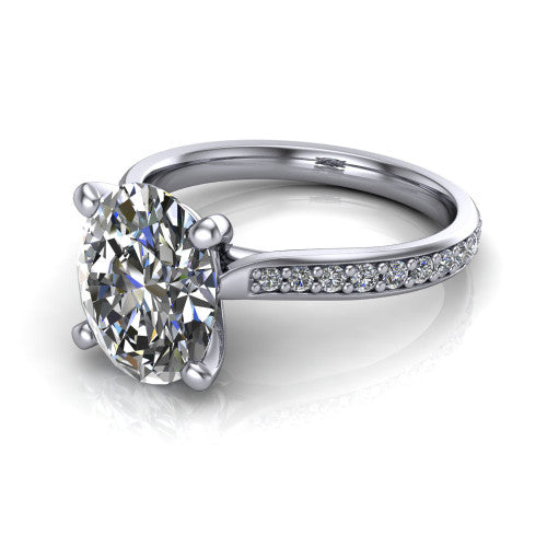 Ruby oval classic engagement ring in Platinum, three-quarter perspective showing the solitaire center diamond raised above a pav&eacute; shank