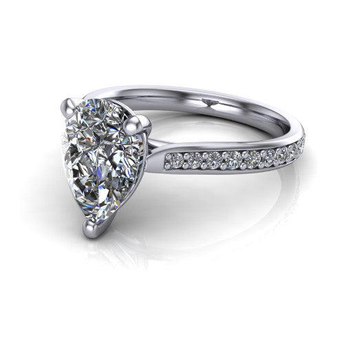 Ruby pear classic engagement ring in Platinum, three-quarter perspective showing the solitaire center diamond raised above a pav&eacute; shank