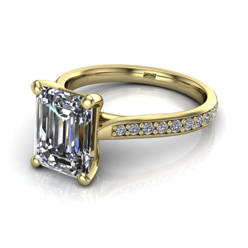 Ruby emerald classic engagement ring in 18K Yellow Gold, three-quarter perspective showing the solitaire center diamond raised above a pav&eacute; shank