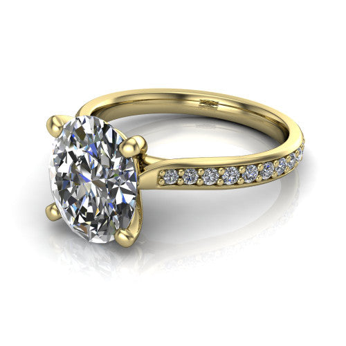 Ruby oval classic engagement ring in 14K Yellow Gold, three-quarter perspective showing the solitaire center diamond raised above a pav&eacute; shank