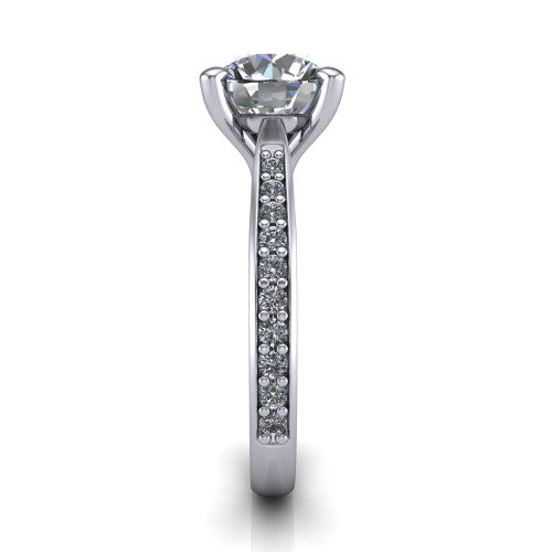 Ruby round classic engagement ring in Platinum, side profile showing the cathedral shoulders and the round diamonds running down the shank
