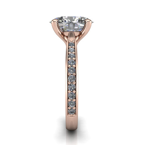 Ruby oval classic engagement ring in 18K Rose Gold, side profile showing the cathedral shoulders and the round diamonds running down the shank