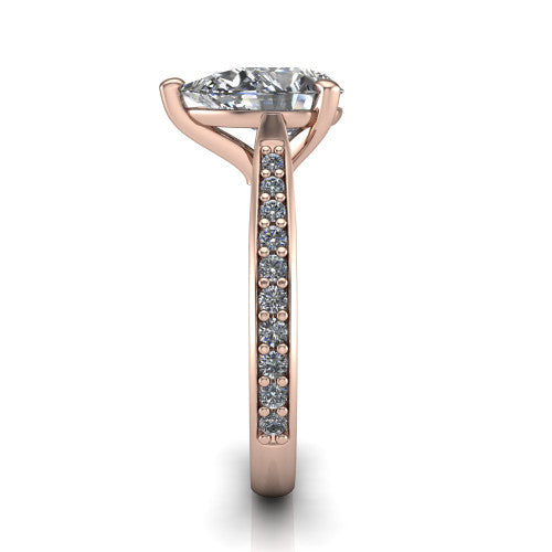 Ruby pear classic engagement ring in 14K Rose Gold, side profile showing the cathedral shoulders and the round diamonds running down the shank
