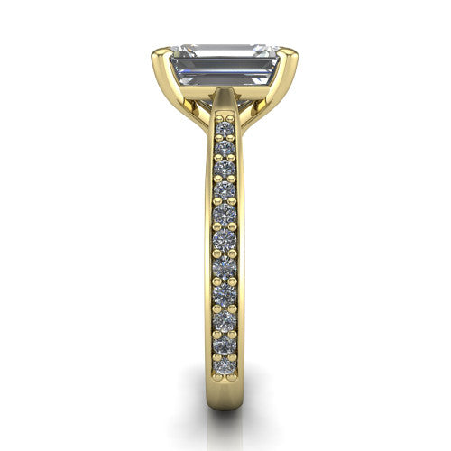 Ruby emerald classic engagement ring in 18K Yellow Gold, side profile showing the cathedral shoulders and the round diamonds running down the shank