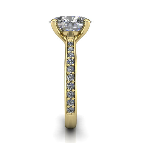 Ruby oval classic engagement ring in 14K Yellow Gold, side profile showing the cathedral shoulders and the round diamonds running down the shank
