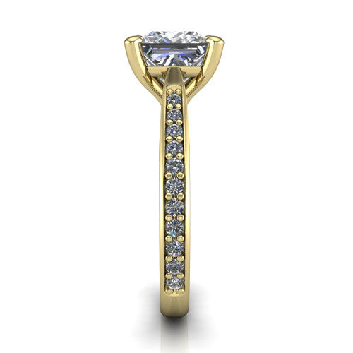 Ruby princess classic engagement ring in 18K Yellow Gold, side profile showing the cathedral shoulders and the round diamonds running down the shank