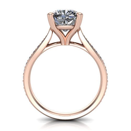 Ruby cushion classic engagement ring in 14K Rose Gold, through-finger front profile showing the solitaire head raised above the pav&eacute; band and trellis gallery