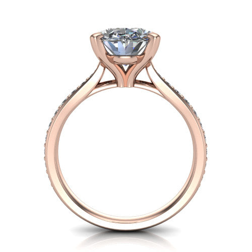Ruby oval classic engagement ring in 18K Rose Gold, through-finger front profile showing the solitaire head raised above the pav&eacute; band and trellis gallery