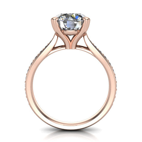 Ruby round classic engagement ring in 14K Rose Gold, through-finger front profile showing the solitaire head raised above the pav&eacute; band and trellis gallery
