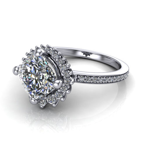 Persephone cushion halo engagement ring in Platinum, three-quarter perspective showing the center framed by a vintage starburst cluster halo above a pav&eacute; shank