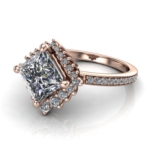 Persephone princess halo engagement ring in 18K Rose Gold, three-quarter perspective showing the center framed by a vintage starburst cluster halo above a pav&eacute; shank
