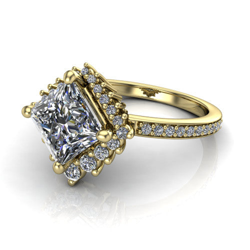 Persephone princess halo engagement ring in 18K Yellow Gold, three-quarter perspective showing the center framed by a vintage starburst cluster halo above a pav&eacute; shank